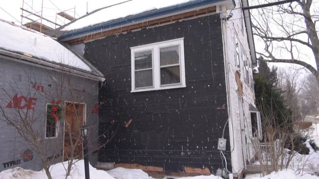 Removing the existing clapboards reveals a mix of building papers installed at various times throughout the building’s life.