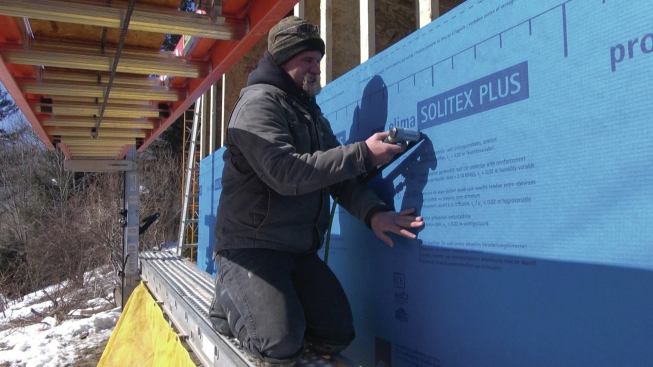 The Pro Clima membrane is stapled to the I-joists.