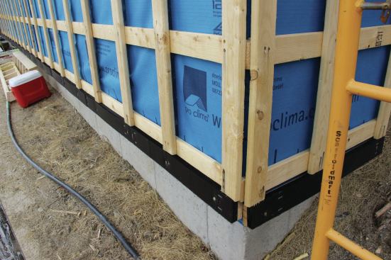 Vertical strapping is applied over horizontal strapping to provide nailing for clapboard siding.