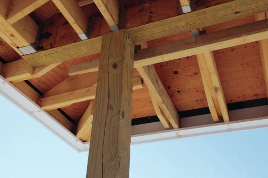 On southern exposures, installing a wood subfascia or blocks between the rafter tails helps to stabilize the fascia.