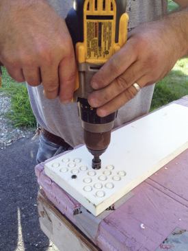 One builder makes his own PVC plugs for screw holes during downtime.