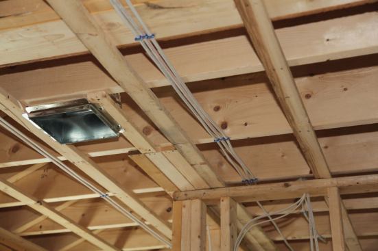 The trades that work in this area always appreciate strapping. Electricians can use the 3/4-inch space to make long runs perpendicular to the floor joists without having to drill holes.