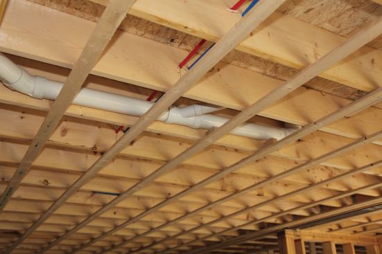 Strapping in existing ceilings also makes snaking wires much easier. Plumbers can also save labor by running their 1/2-inch PEX tubing below the joists; and they can use the strapping to support waste and vent pipes at the required pitch.
