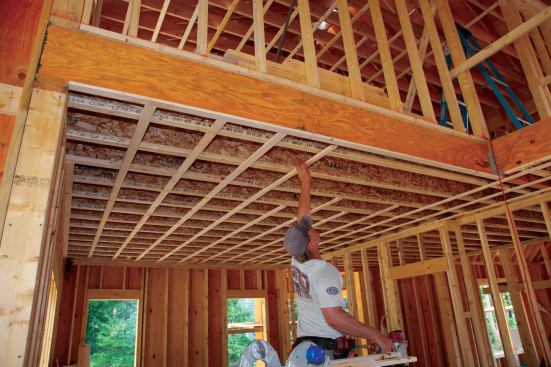 At the same time, his workmate saws the pieces to length in place, staggering the lengths between joists. For us, this method is faster than measuring and pre-cutting the pieces. After the cut ends are nailed up, the carpenters move across the room adding full lengths of strapping. Once all of the full-length pieces are tacked in place, one carpenter cuts finish pieces to length ...