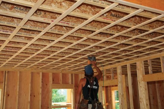 ... while his partner nails off the entire roomwith the nail gun.