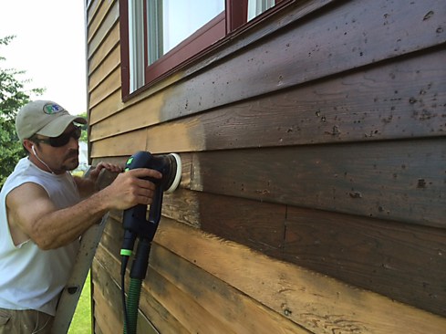 Depending on the extent of the damage, we made the decision on the fly whether to sand down to bare wood or just scuff-sand to induce bonding of the new finish. Using Festool Rotex RO 125 sanders attached to Festool CT Midi Dust Extractors, we worked our way from the bottom of the building to the soffit.
