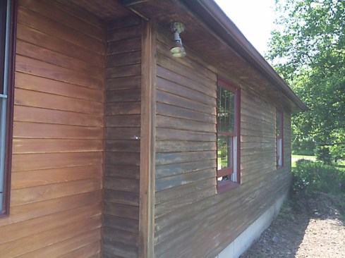On the building’s one undamaged façade, the finish was not pockmarked at all, and the Sikkens was for the most part well-bonded to the siding and trim. 