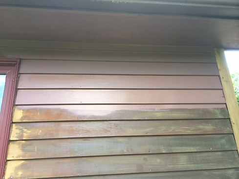 Our clients wanted to maintain a dark brown exterior, but didn’t want a transparent stain. We suggested using a deep-base acrylic primer, which we could tint to match the finish coat. The tinted primer afforded a degree of coverage, allowing us to apply just one finish coat. Working from the top down, we applied Sherwin Williams Multi-Purpose Latex Primer/Sealer primer, a high-adhesion primer that helps hide surface imperfections. We brushed it on, rather than spraying; the brush mechanically forces the primer into the grain for better adhesion.