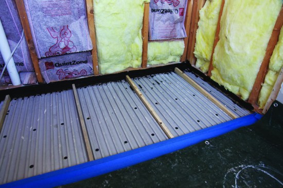 Tapered screed sticks established a 1/4-inch-per-foot drainage slope.