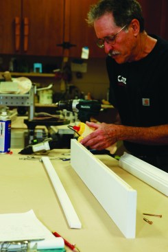 Once the self-returns are assembled, I glue the frieze to the architrave molding.