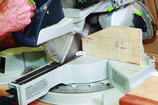 I swing the saw to 90 degrees and slice off the other self-return cap.
