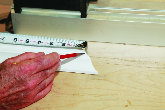 I hook a tape where the long point cuts through the bottom fillet on the molding.