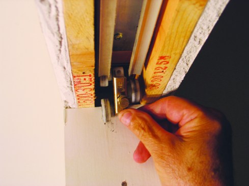 Then I set the wheeled hangers in the track.