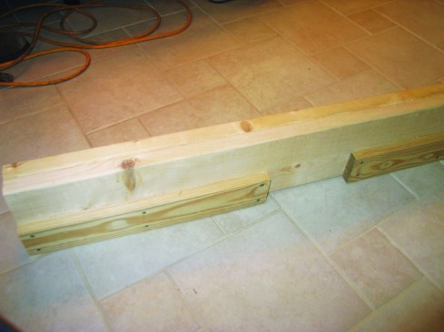 To fill the entire width of the 4-inch cavity, I padded out the header with a piece of 5/4 material, leaving a gap to accommodate the vertical 5/4 backer board that I had installed earlier.