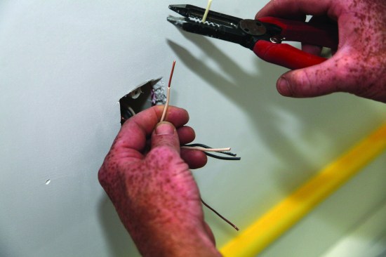 Wire strippers remove an inch or so of insulation from each conductor.