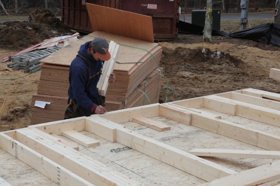 Sill Layout The crew member places the sill for each window against the plate and copies the cripple layout onto the sill.