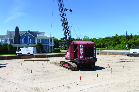Before pilings are driven, an engineer lays out the positions of each one.