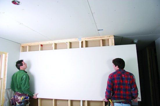 Mark stud locations before lifting the sheet.