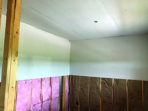 Don’t cut too precisely — small gaps in corners are covered in the taping process