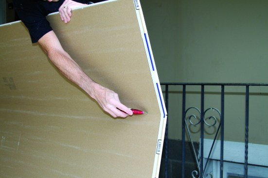 Snap the sheet back and score from the other side to remove the rip.