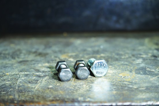 Bolts for residential steel work should all have an ASTM number stamped on the head, which means that they have a specific strength rating. A307 is a non-high strength bolt.