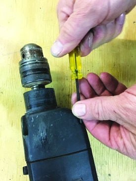 ... and replaces the screws from the chuck end of the tool.