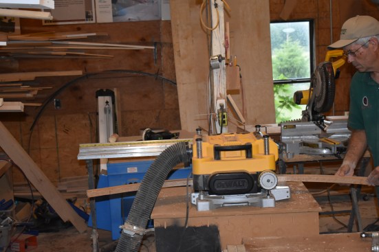 The author finishes planing the nosing to the proper thickness using a bench-top planer.