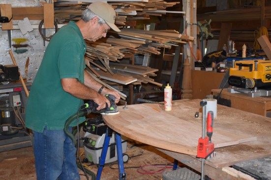 After the glue kicks, the author gives the tread a good sanding.