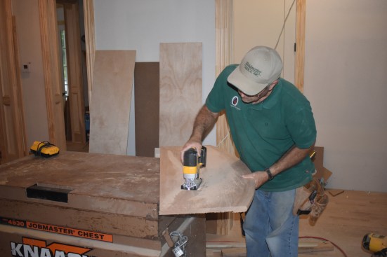 The author does the initial cut of the inside curve using a jig saw. Because the cut will be covered by the riser, it does not have to be as perfectly smooth and even as the nosing.