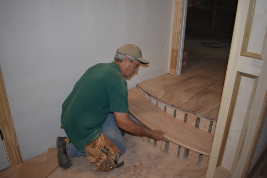 The author then places the tread into the wet adhesive.