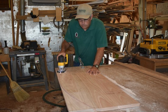 The trammel-mounted router assures a fair curve at the proper radius, and a jig saw roughs out the initial cut.