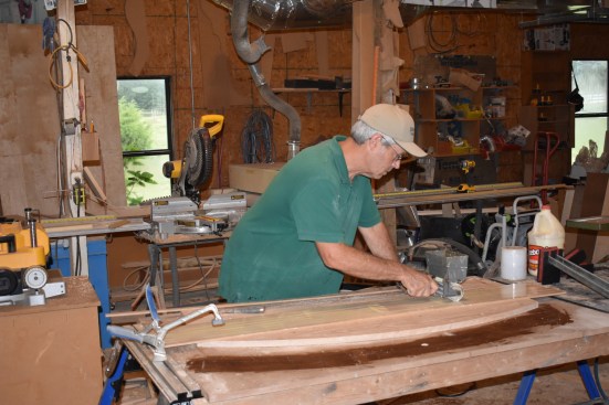 The author lays the strips in order on the flat step and spread carpenters glue on one side.