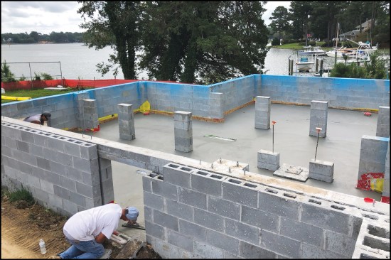 Figure 11. A small slab can be fitted with a single drain, while a large crawlspace requires several drains, with each slab section sloped toward a drain.