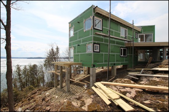 Figure 2a. The bedroom-office wing was “floated” on the piers. Here, the deck was being framed on the home’s elevated southeast corner.