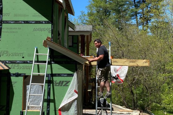 The wall of the second-floor shed dormer was moved 3 feet back from the first-floor’s exterior wall. (This “mass-reducing” roof with integral built-in gutter was framed over the resulting exposed second-floor deck.)
