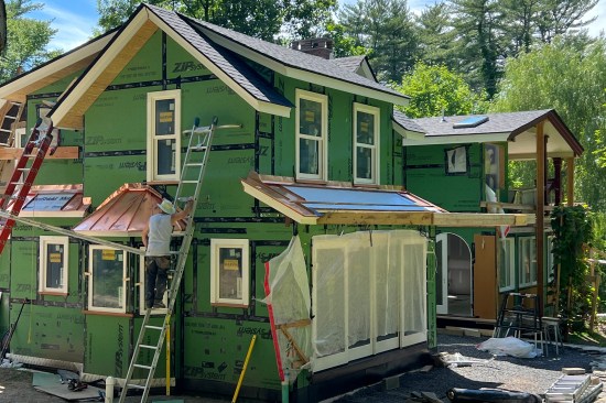 Per the homeowner’s request, the lower roofs were dressed up with copper; the upper roofs were asphalt shingle.