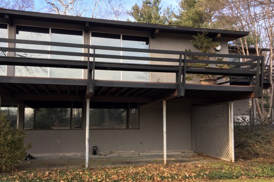 The existing deck ran the length of the home’s rear elevation, its 8-foot-wide by 50-foot-long surface was supported by seven 4x12 Douglas fir beams spaced at 8-foot on-centers. The beams were in turn were supported by 3-inch-diameter steel columns set back 4 feet from the deck edge.