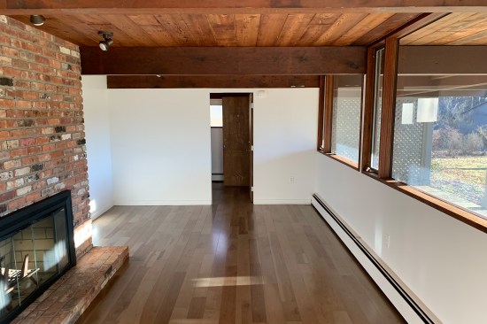 The 4x12 fir beams that span the width of the home look intact, and it was assumed (wrongly) that the 14-foot “cantilevered” lengths of fir (which supported the cantilevered floor and original deck) had been removed when the original deck was replaced sometime in the late 1980s, early 1990s. See “Rotted Doug Fir Beams” slideshow.