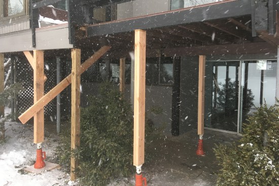 The existing deck and cantilevered floor were posted up prior to demolition.