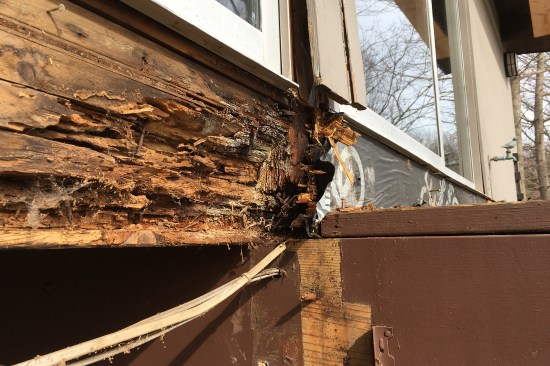 8-inch-high raised thresholds under existing sliders showed signs of damage from years of water infiltration.