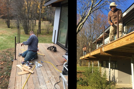 Crew members install the stainless steel cable-railing system, shown here before the ipe top rail was installed. The exposed pressure-treated framing and the ends of the Parallams, were later trimmed off the deck with 3⁄4-inch mahogany.