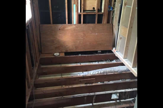 Floor systems need to be strong and stiff enough to support tile, but often in an existing home, they are underdesigned, out-of-level, and structurally compromised (as shown here) and need to be evaluated by a design professional.