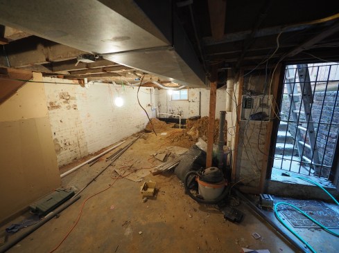 Before the job begins, the basement must be cleared out, including removing duct work, framing—even the stairs leading to the first floor. 