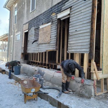 What started as a kitchen remodel became a major structural repair as the crew began demolition. With temporary walls shoring up the exterior wall, work to clean up the foundation begins.