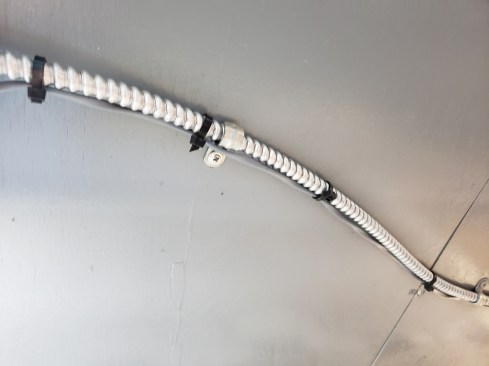 Much like a house, before I installed the finishes, I routed BX conduit all over the trailer for outlets and switches.