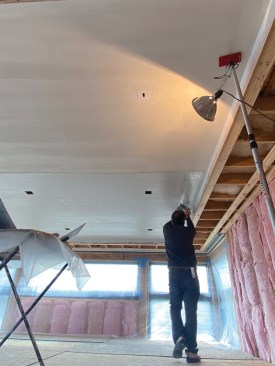 The first step was to plaster the ceiling, including turning the plaster down the inside corners at the perimeter.
