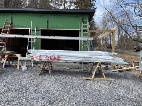 The exterior trim and siding begin once the garage has been framed and weathered in.