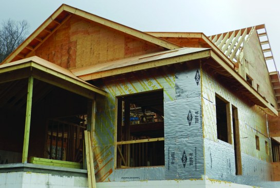 As the framing went up, plywood sheathing was installed, and polyiso foam was installed right behind it. We chose polyiso because it has the highest R-value per inch (6.5), allowing us to add almost 10-R to the wall without having to incur the expense of custom windows. The choice of plywood as the sheathing was dictated by a more subtle performance issue.