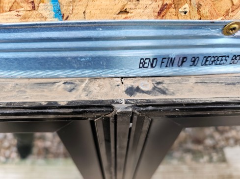 Once the exterior window trim was removed, the author observed a slight gap above one mullion. Some silicone sealant had been used here, but it did not fully seal the gap. 