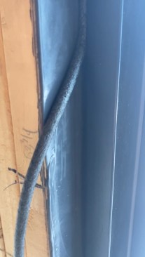 The spaces between shims are filled with backer rod.